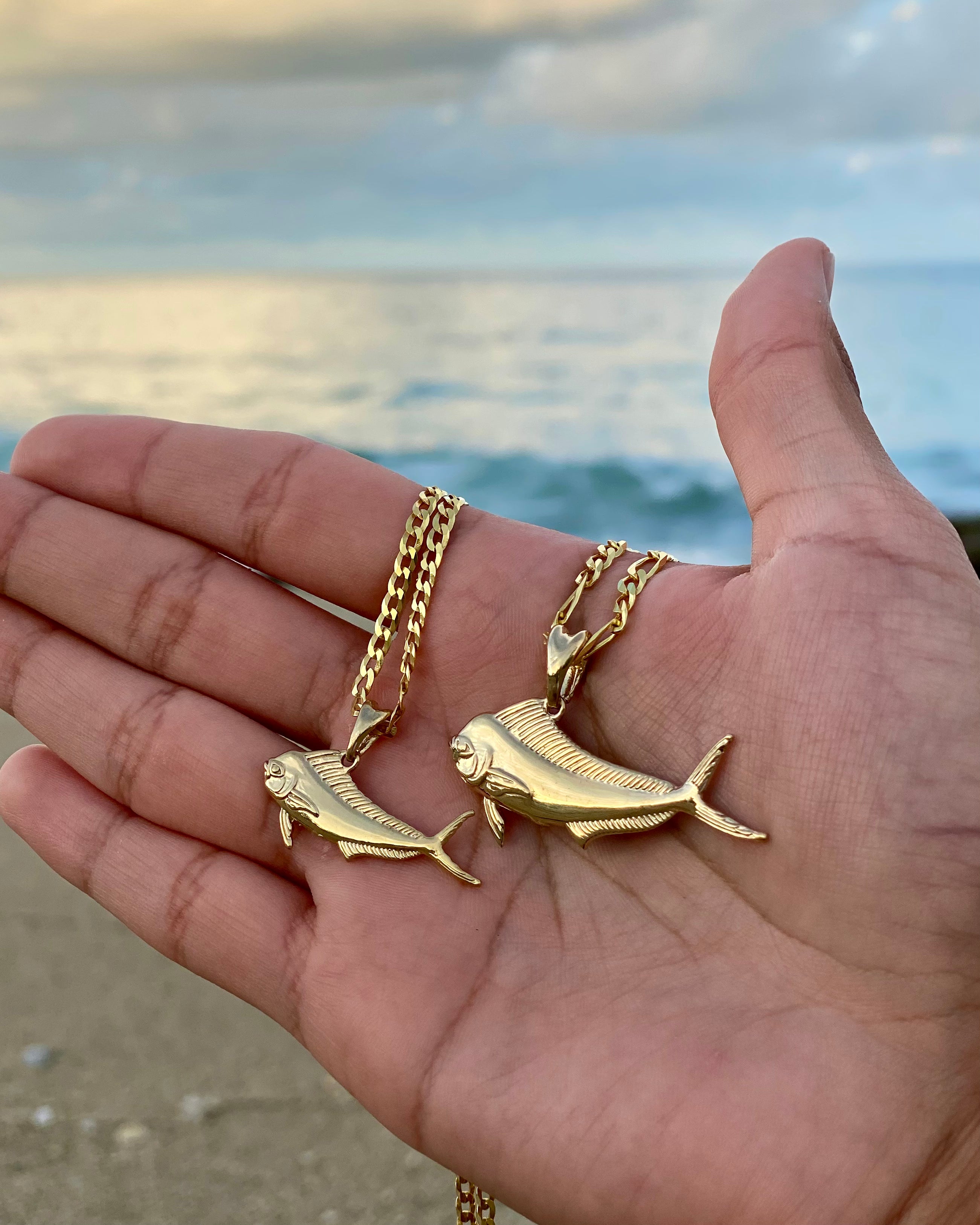 small and standard sized gold mahi mahi necklaces by castil