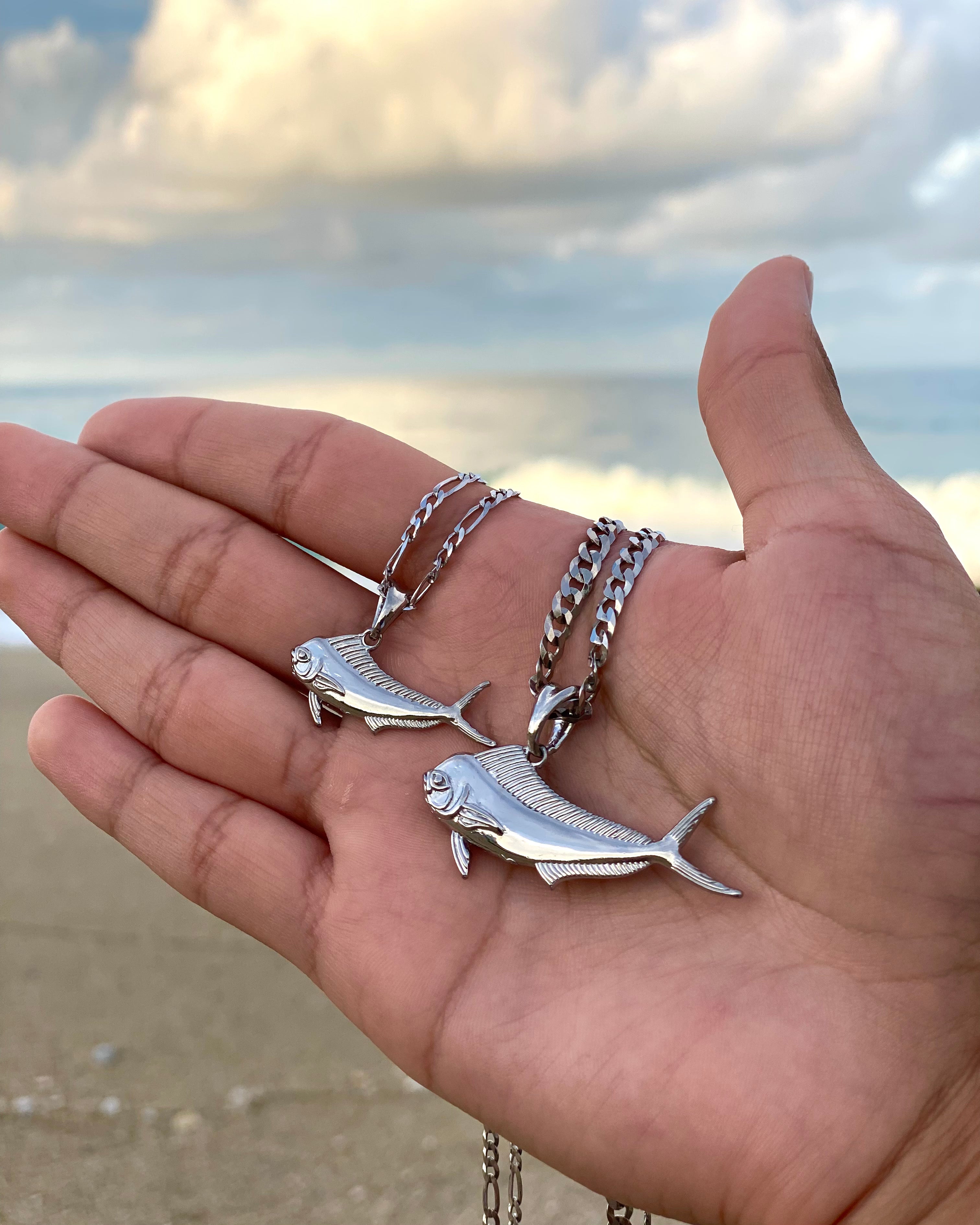 small and standard sized silver mahi mahi necklaces by castil