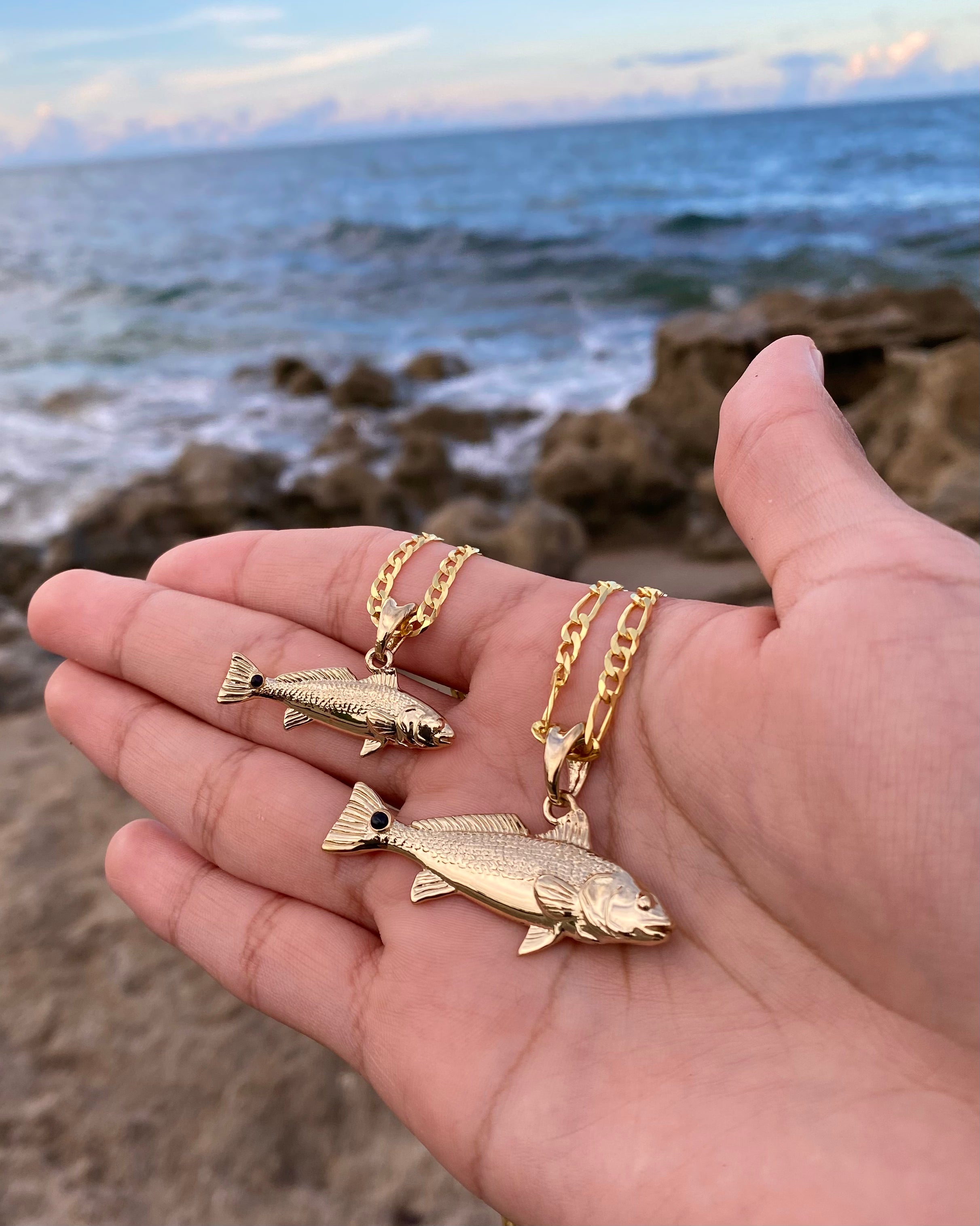 Standard and Small size Redfish necklaces in gold by Castil.